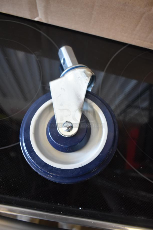Heavy-duty swivel caster wheel, blue and white, metal mounting bracket, new condition, for industrial use.
