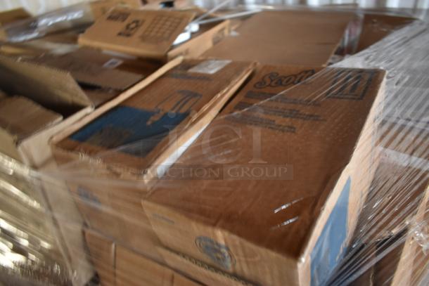 Pallet wrapped in clear plastic containing multiple sealed cardboard boxes labeled "Scott."