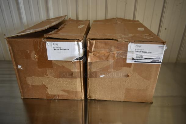 Two boxes of Choice full-size foil steam table pans, labels indicate medium gauge, boxes visibly worn.