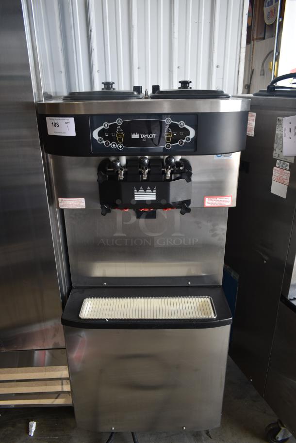 Taylor commercial soft serve machine, stainless steel, three dispensers, model number visible, excellent condition.
