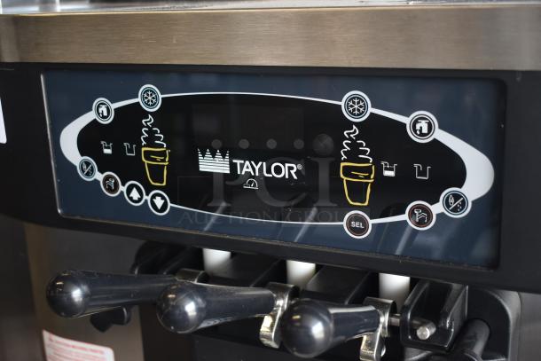 Taylor ice cream machine control panel, stainless steel finish, modern interface with illuminated buttons, excellent condition.