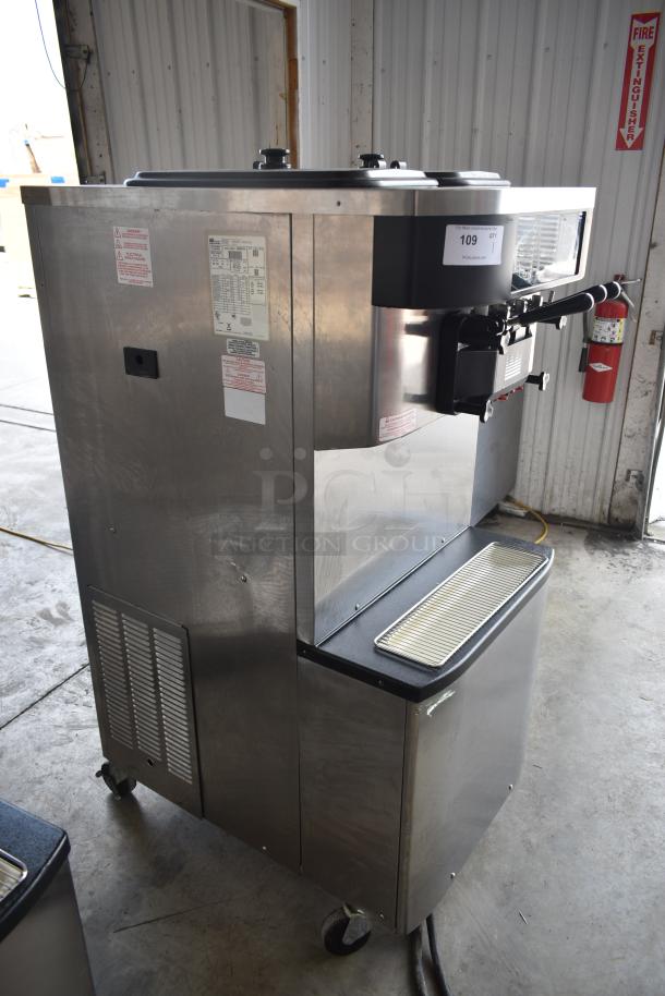 Stainless steel ice cream machine, commercial-grade, dual nozzles, model tag labeled 109. Appears in good condition.