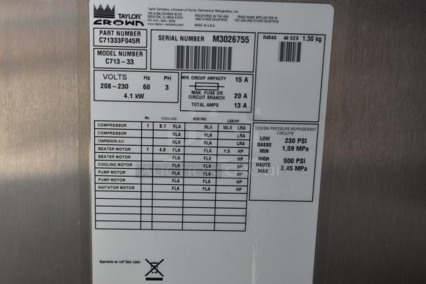 Label on Taylor C713 soft serve machine, showing model C713-33, serial M3026755, voltage 208-230, and specs.