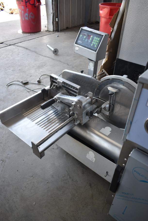 Industrial meat slicer with digital control panel, stainless steel construction, used condition, visible wear on surfaces.