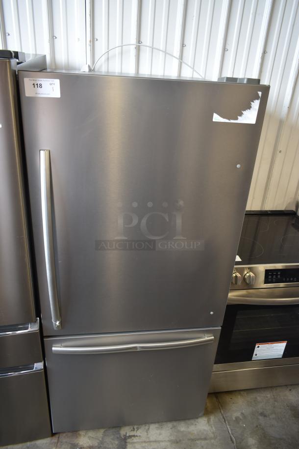 Stainless steel refrigerator with bottom freezer, long handles, good condition, auction tag reading "118 QTY 1".