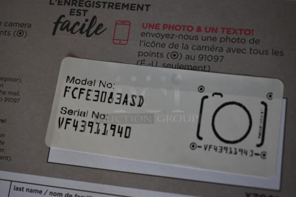 Label with Model No: FCFE30EA3D, Serial No: VF43911940, attached to a registration card.