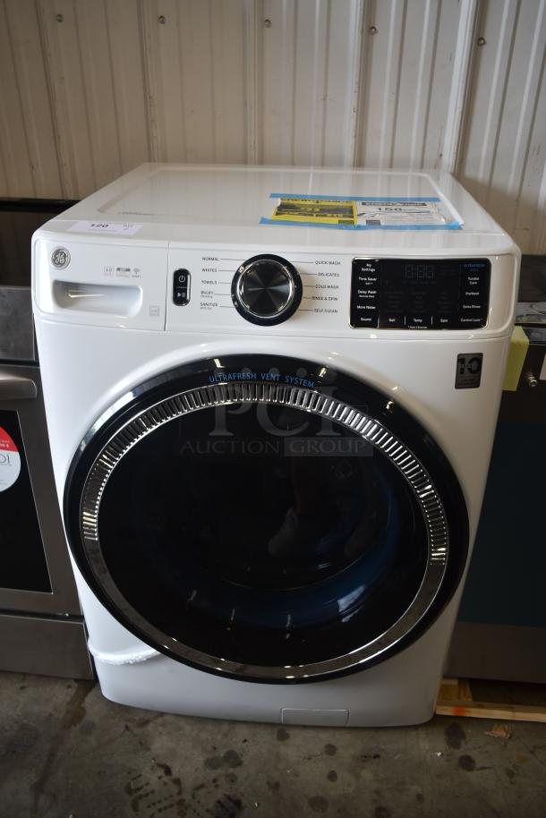 GE front-load washer with UltraFresh Vent System, digital controls, and multiple wash cycles; model displayed in new condition.