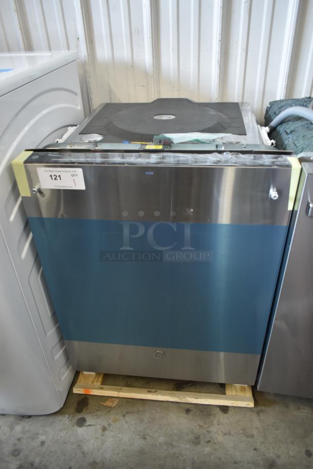 Stainless steel dishwasher with a blue protective film, marked "121, QTY 1." New condition, resting on wooden pallet.