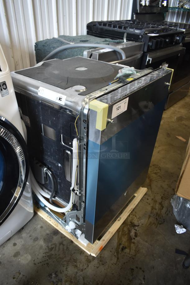 Industrial dishwasher, blue door panel, top-side view, on a pallet, auction tag "121", stainless steel finish, new condition.