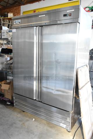 LIKE NEW! Avantco 178CFD2FF Stainless Steel Commercial 2 Door Reach In Freezer w/ Poly Coated Racks on Commercial Casters. 115 Volts, 1 Phase.
