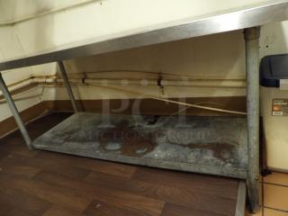 Stainless Steel Table with Lower Shelf, Left side legs are shorter than Right side legs.