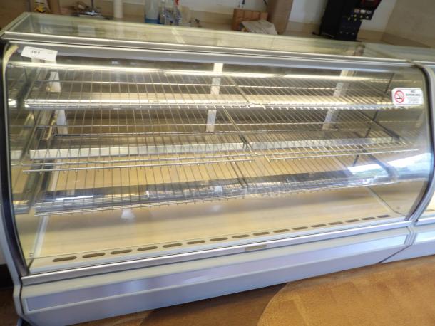 One Structural Concepts Curved Glass Refrigerated Bakery Display Case. 220 Volt. Curved Glass In Front, With 2 Rear Slide Doors, Lighted Donut Display Case, 4 Rack Powers on and works as should - Image 3 of 5