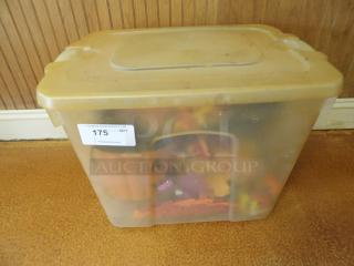 Plastic storage bin with lid, filled with assorted items. Auction tag "175," suggesting bulk content for PGIauctions.com.