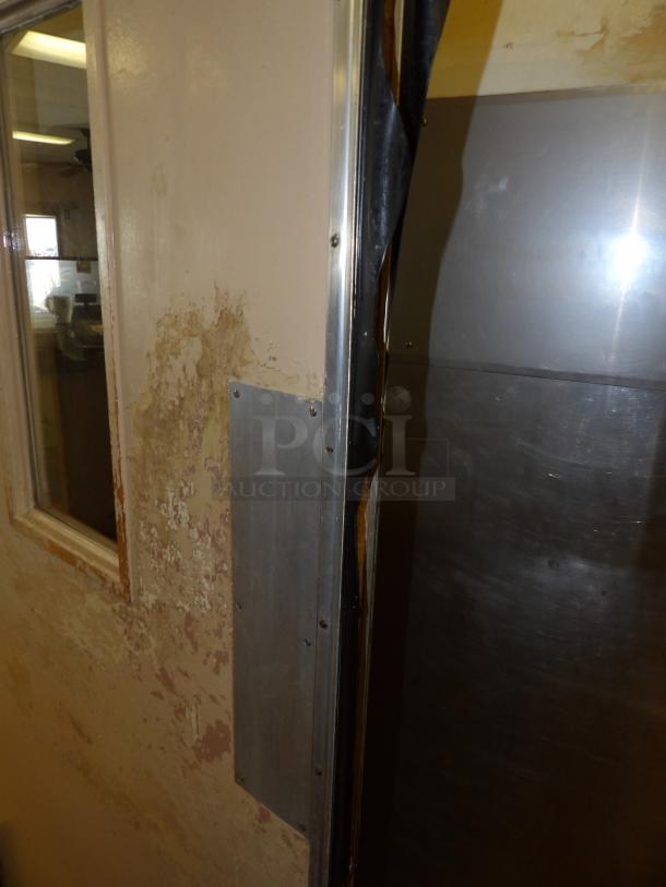 Metal door with window, visible peeling paint, and rust. Metal kick plate attached. Used condition, suitable for restoration.