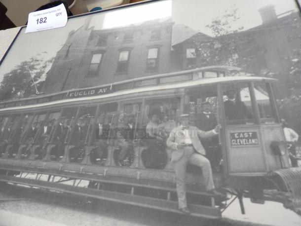 Black and white photo of a vintage streetcar labeled "Euclid Av" and "East Cleveland," showing passengers and a conductor. Auction tag reads 182.