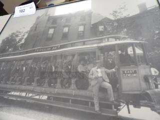Black and white photo of a vintage streetcar labeled "Euclid Av" and "East Cleveland," showing passengers and a conductor. Auction tag reads 182.