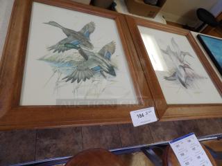 Framed bird artwork featuring ducks in flight, vibrant colors, wooden frame, auction tag label 184, excellent condition.