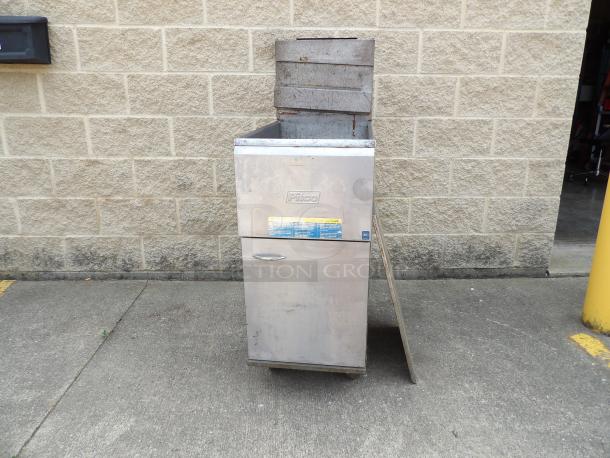 Pitco stainless steel deep fryer with visible model label. Shows signs of use, suitable for commercial kitchen purposes.