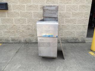 Pitco stainless steel deep fryer with visible model label. Shows signs of use, suitable for commercial kitchen purposes.