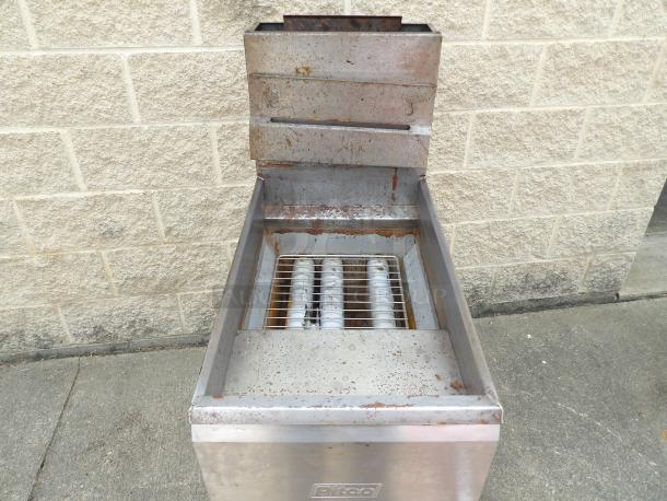 Commercial deep fryer with stainless steel body, showing signs of rust and wear. No visible brand or capacity markings.