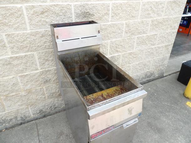 Commercial deep fryer with visible wear and rust, metal construction. Red label reads "Dean." Ideal for restaurant kitchens.