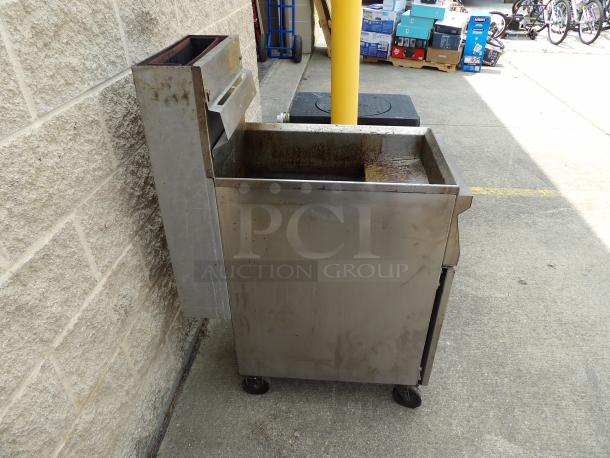 Stainless steel commercial deep fryer, used condition, with rust and wear visible, on casters for mobility. Ideal for auctions.