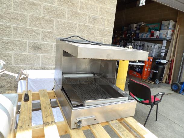 Commercial stainless steel conveyor toaster, lightly used, open top design, adjustable settings, minor wear on exterior.