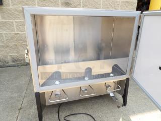 Stainless steel enclosed food warmer with three compartments, excellent condition, showing lockable door and heating elements.