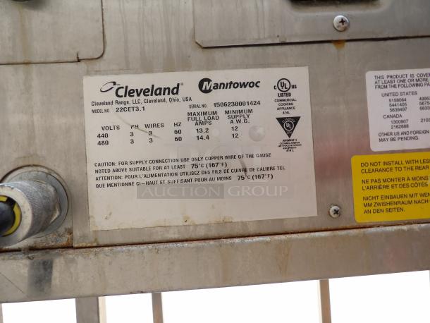 Close-up of a Cleveland Range model 22CET3.1 label on stainless steel, showing electrical specifications and safety warnings.