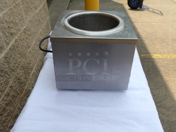 Stainless steel industrial soup warmer, cylindrical interior, used condition, exterior handles, no visible markings.