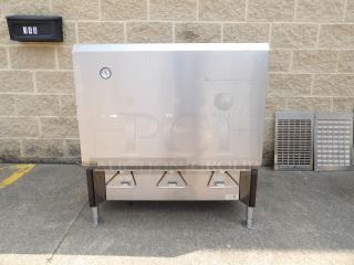 Stainless steel commercial milk dispenser with three spouts, pressure gauge, and "CHOCOLATE MILK" label; good condition.