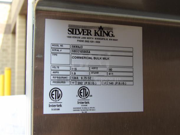 Silver King commercial bulk milk dispenser tag, model SKMAJ3, serial SBEG165965A. 115 volts, 1.9 amps, refrigerant 134A.