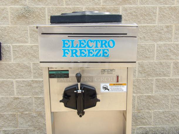 Electro Freeze soft serve ice cream machine, stainless steel, single dispenser, visible control panel, used condition.