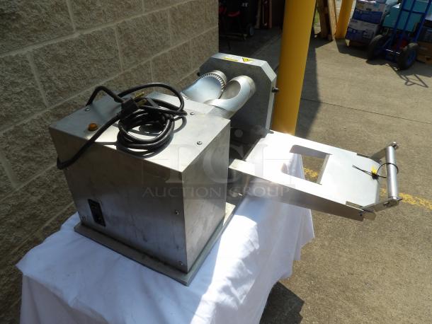 Industrial metal slicer with a power cord, used condition, featuring a feed chute and adjustable settings.