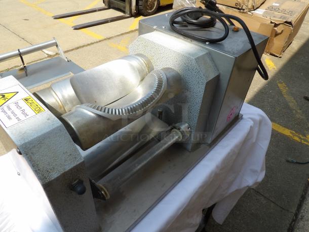 Industrial metal roller machine with electric cord, pinch point warning label, and sturdy metal construction. Good condition.