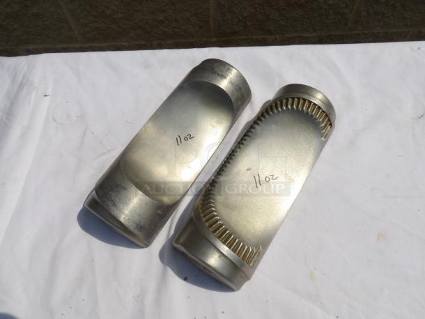 Two metal mold parts, labeled "11 oz," with distinct cutting edges; used, good condition.
