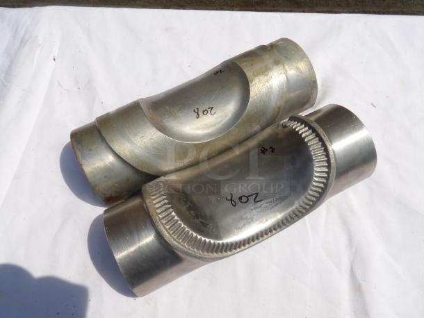 Two stainless steel exhaust pipe connectors, marked "208" and "#2." Showcasing smooth finish and welded seams.