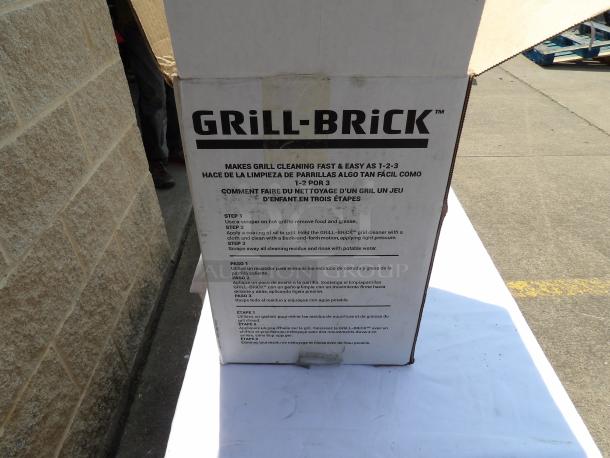 Grill-Brick box with cleaning instructions in English, Spanish, and French. Used for grill cleaning. Box in good condition.