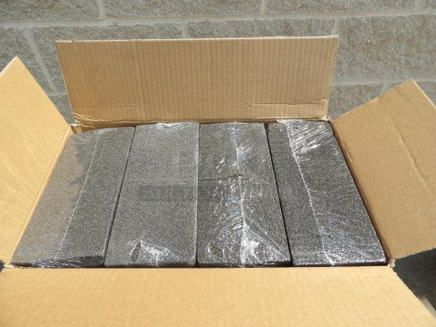 Box of five new black foam blocks, packaged in plastic wrap, in a cardboard box. Perfect condition.
