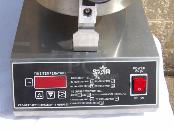 Star press machine with digital display and controls for temperature and time, power switch, and pre-heat instructions.