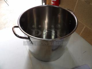Stainless steel stock pot with two handles, showing light wear. No visible brands or labels. Suitable for large-scale cooking.