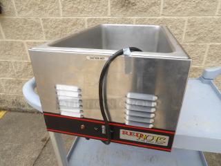 Stainless steel food warmer by The Eagle Group, RE*:PORT model; features "Caution Hot" label; electrical cord attached.