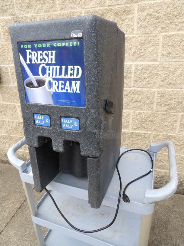 Chilled cream dispenser, Creamiser brand, labeled for half & half. Features plug and prominent signage. Good condition.