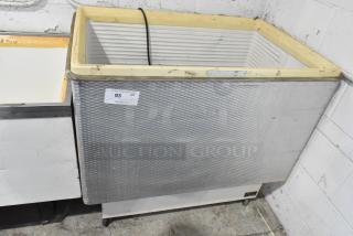 Master-Bilt Metal Chest Freezer Merchandiser on Commercial Casters.