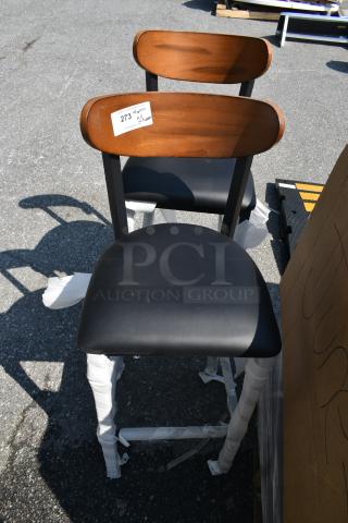 2 BRAND NEW SCRATCH AND DENT! Lancaster Table & Seating Black Metal Bar Height Chair w/ Wooden Back Rest and Black Seat Cushion. 2 Times Your Bid!