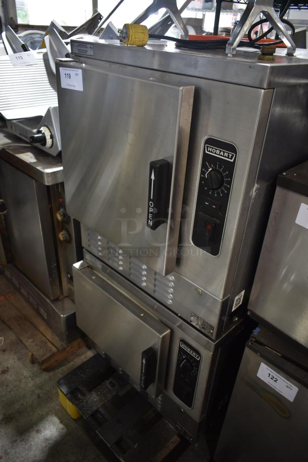 Hobart commercial double oven, stainless steel, model with dial controls. Visible lot tag: 119. Good condition.