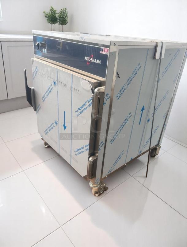 Alto-Shaam commercial oven, stainless steel, new condition, protective film, American flag sticker, on casters.