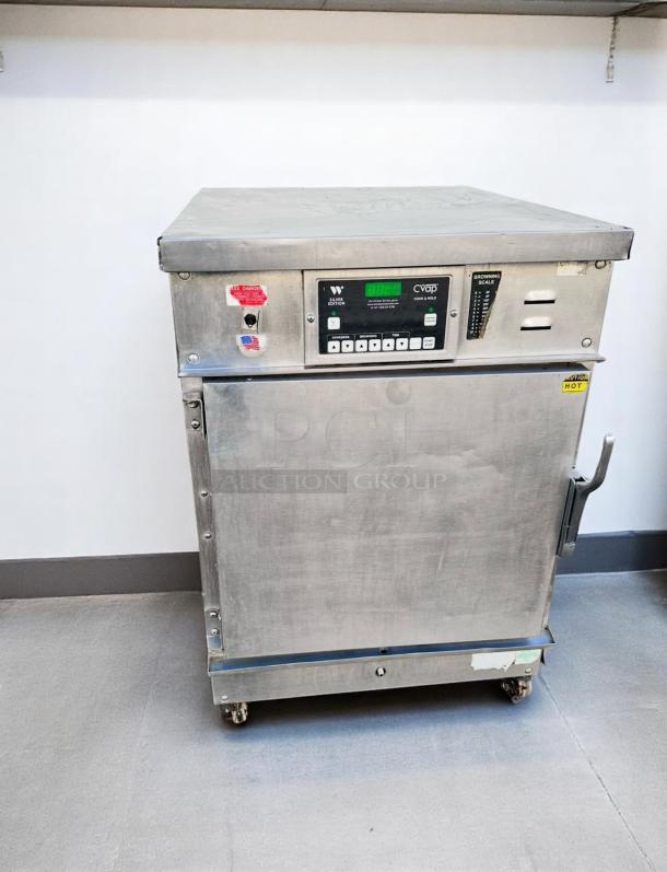 Winston CVap food warming cabinet, stainless steel, digital controls, adjustable browning scale, good condition, on wheels.
