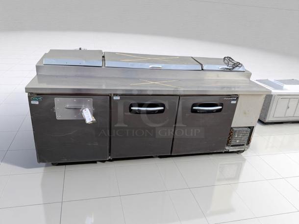 Norlake AdvantEDGE commercial stainless steel prep table with two doors, minor surface wear, includes a BP 711 tag.