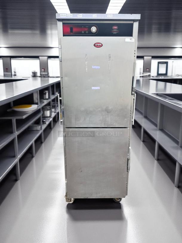 Commercial FWE heated cabinet with digital controls and metal exterior on casters, in used condition. Suitable for professional kitchens.